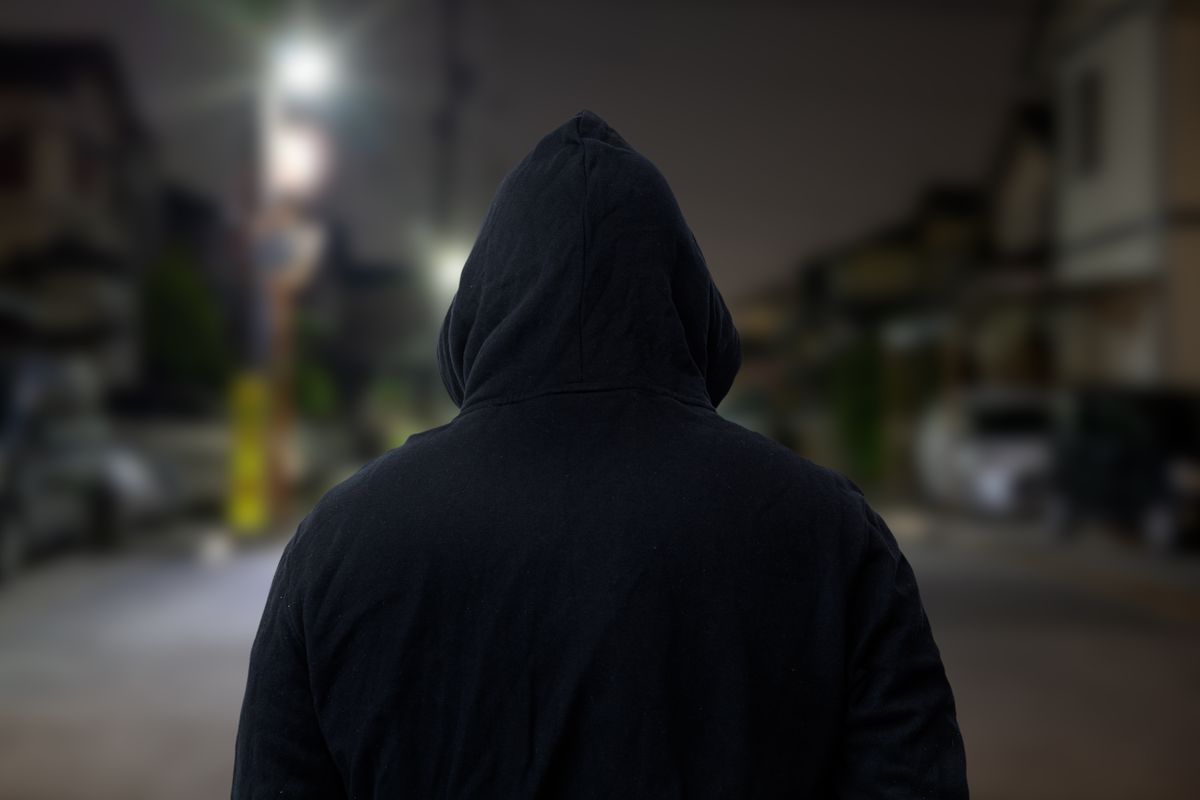 The,Back,View,Of,A,Suspicious,Person,Wearing,A,Hood.